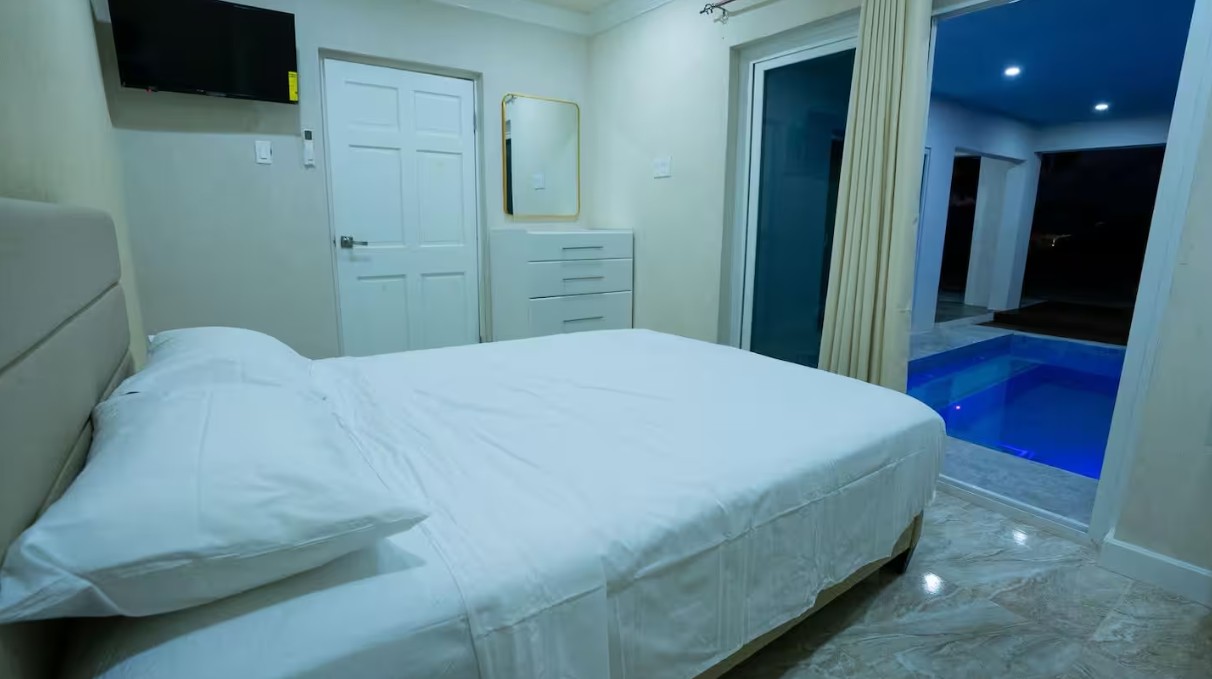 Bedroom with king bed facing the pool