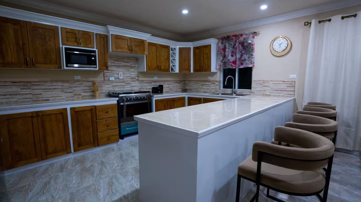 Kitchen with timber cabinets and breakfast bar